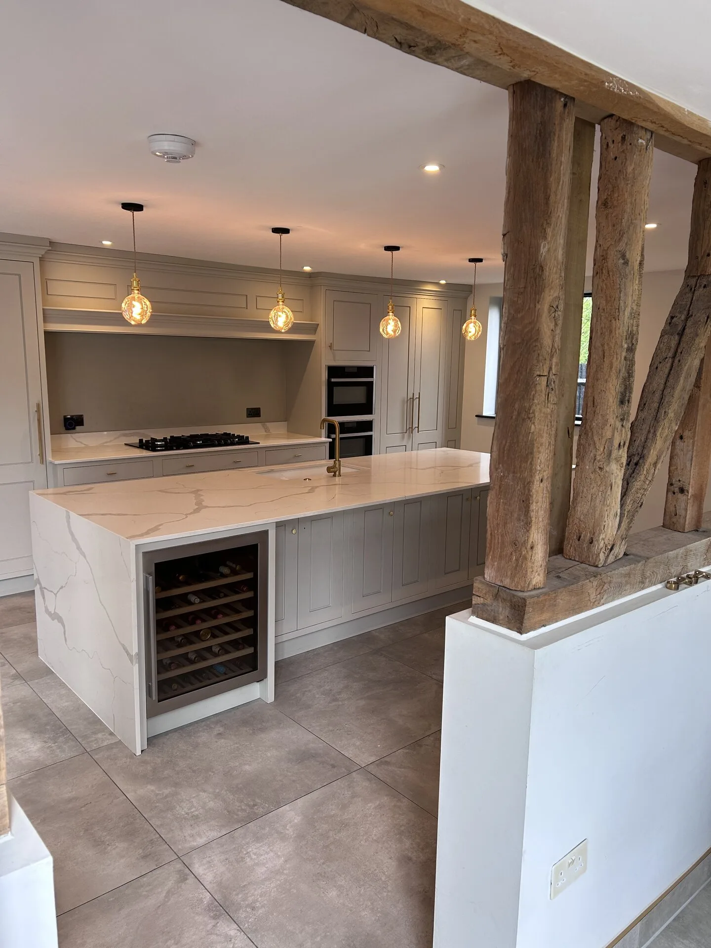 Shaker kitchen with oak beams