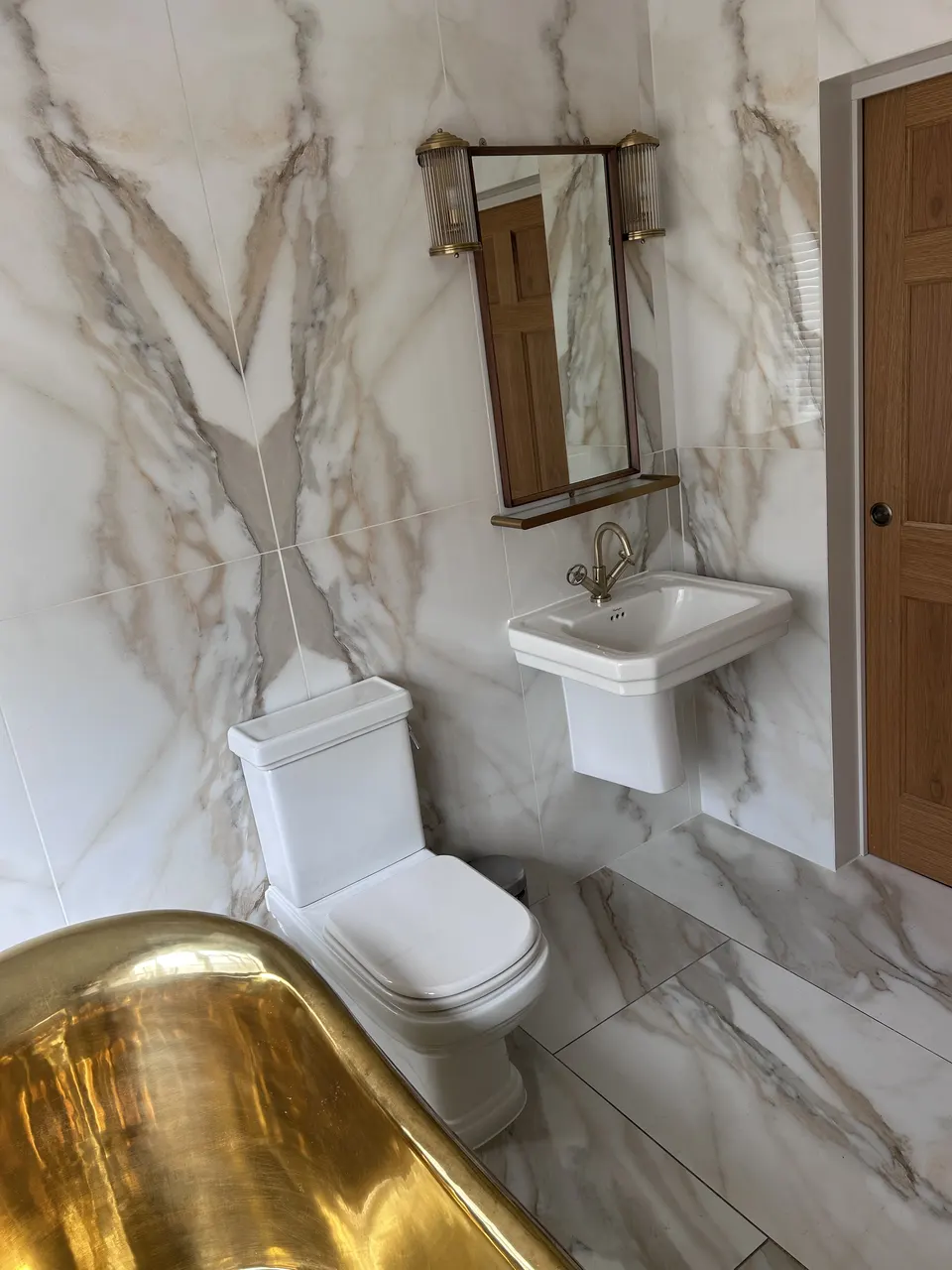 Marble bathroom with brass fittings