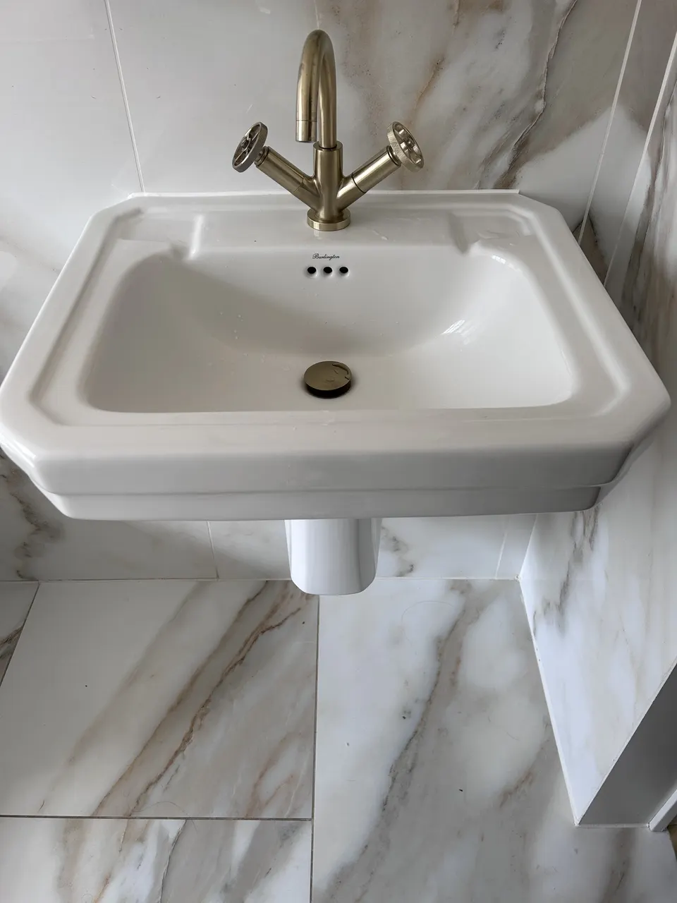 Period basin with brass tap
