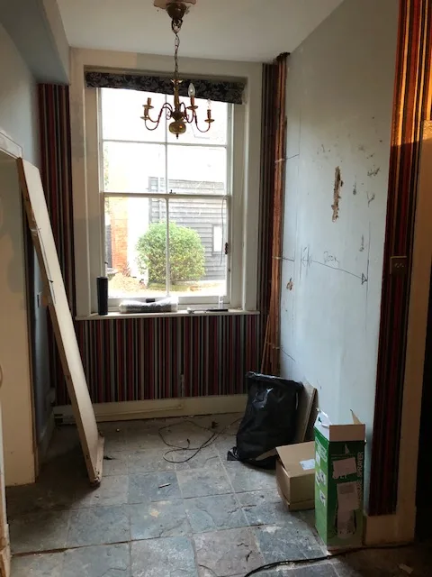 Listed building kitchen sink wall before restoration in Essex
